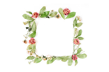 Round frame wreath pattern with roses, pink flower buds, branches and leaves isolated on white background. Flat lay, top view