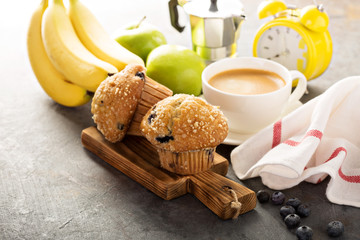 Blueberry and banana muffins with coffee for breakfast