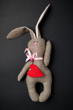 Easter bunny on a black background. Rabbit. Easter ideas. Easter eggs. Space for text.