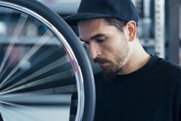 Close-up of bearded craftman looking down