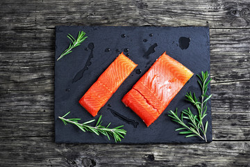 salmon fillet with fresh rosemary and drops of olive oil