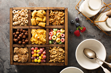 Variety of cold cereals in a wooden box overhead