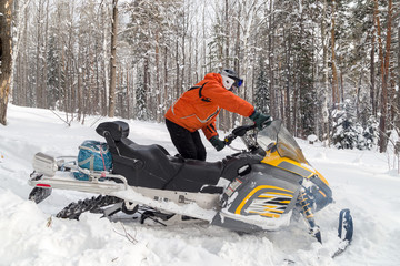 Athlete on a snowmobile