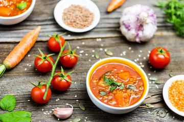 Vegetable Soups with Cooking Ingredients on Wooden Background