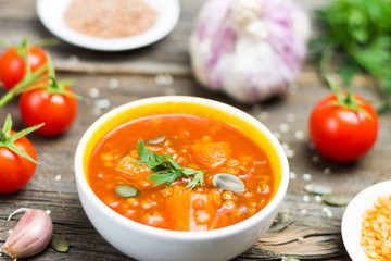 Fresh Bio Vegetable Soup Detail with Cooking Ingredients on Wooden Background
