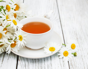cup of herbal tea with chamomile flowers