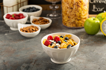 Cereal bar or buffet wih cornflakes, fruit and nuts
