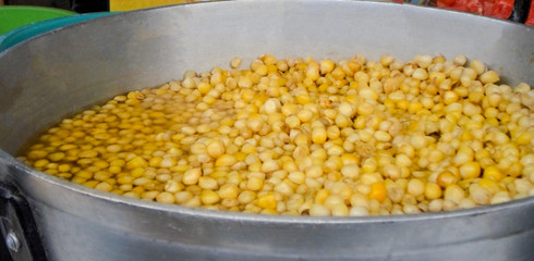 Cooking corn grains in a pot at Otavalo Market in Ecuador