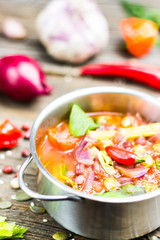 Fresh Food. Bio Vegetable Soup with Chickpea and Adzuki Beans in Pot with Cooking Ingredients on Wooden Table Background