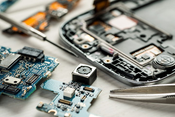 Parts of digital gadgets with tools. Repair and service concept