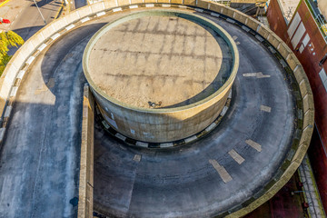 Overhead view of a car parking entrance road. Aerial view. Top view