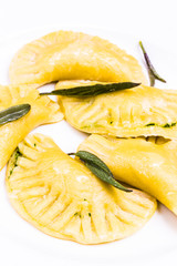 Ravioli with Salvia Leaves Detail on White Plate