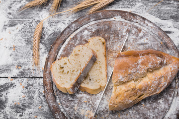 Bakery concept background. White sliced bread and knife