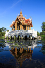 Thai art golden pavilion on the lake