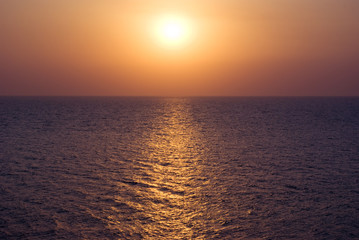 Sunset at the sea water surface