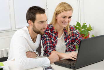 attractive man and woman business using laptop computer