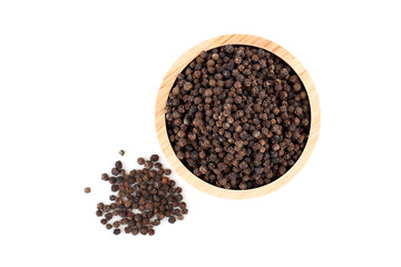 black peppercorns in wooden bowl