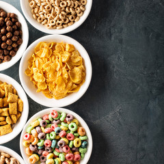 Variety of cold cereals in white bowls