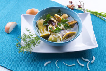 White mushrooms marinated with onions.
