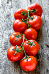 Ripe tomatoes on wooden table