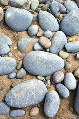 close up of pebbles on a beach (big blue stones)
