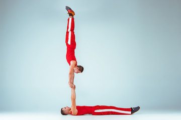 The two gymnastic acrobatic caucasian men on balance pose