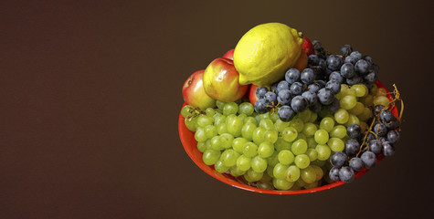 Still life of fruit on a black background.