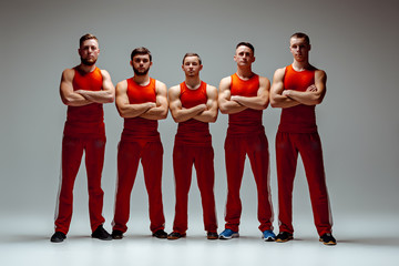 The group of gymnastic acrobatic caucasian men