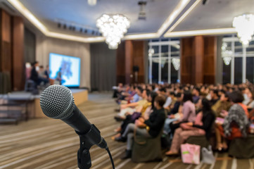 Microphone over the Abstract blurred photo of conference hall or - 137051968