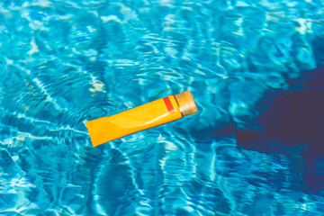 Sunscreen lotion in swimming pool