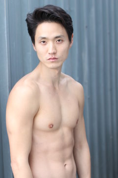 Sensuous Asian man shirtless close up