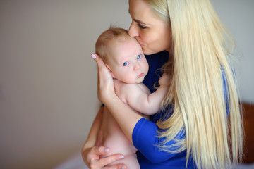 happy mother with the newborn on hands