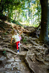 Children - twin girls are hiking in the mountains.