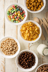 Variety of cold cereals in white bowls