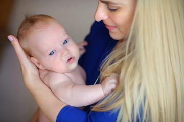 happy mother with the newborn on hands