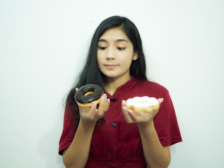 Asian woman holding donut on white background, red shirt, black long hair