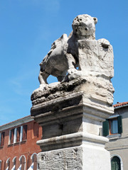 The old stone sculpture of the Lion of Saint Mark on island Murano, Italy. 