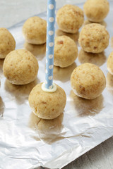 How to make cake pops - applying stick to the cake ball