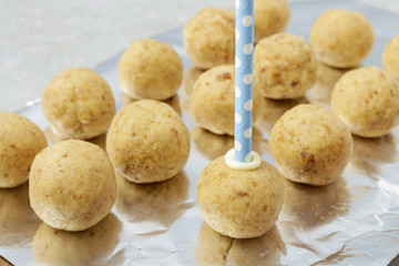 How to make cake pops - applying stick to the cake ball