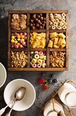 Variety of cold cereals in a wooden box overhead