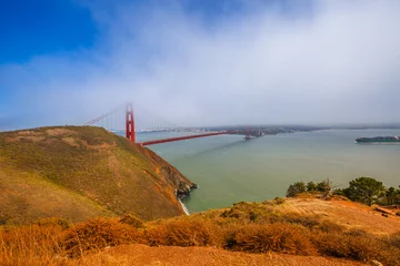 Fototapeten Golden Gate Bridge from Marina's Vista Point at sunset, north shore, Mill Valley, San Francisco Bay, California. Fog in the summertime. Symbol and icon of San Francisco. American travel concept. © bennymarty