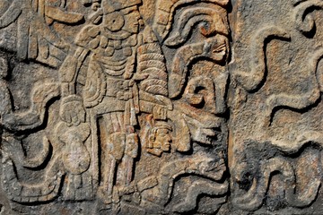 Detail of Mayan wall carving with warrior