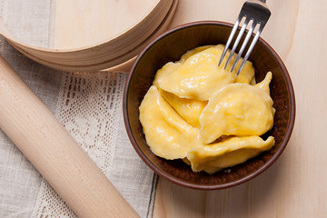 Fresh boiled varenyky or dumpling with cottage cheese or curd in