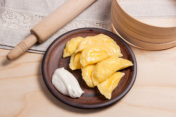 Fresh boiled varenyky or dumpling with cottage cheese or curd on