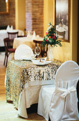 Wedding flower arrangements on the table in restaurant