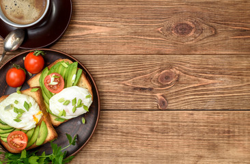 Obraz na płótnie Canvas Sandwich with avocado and poached egg. Breakfast .