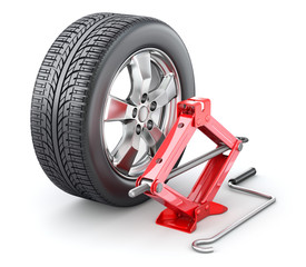 Car wheel with red scissor jack on white background