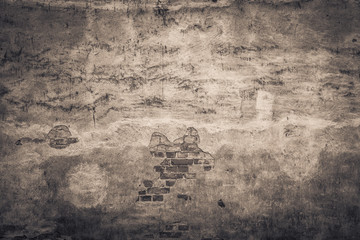 Empty stone wall with damage and cracks. Old grungy building with nice weathered texture. Background with copy space. - 137062508