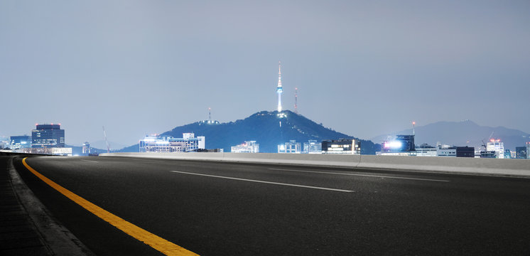 cityscape and skyline of seoul from empty road