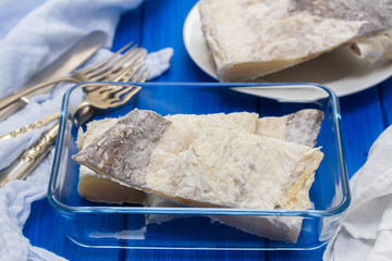 salted raw dry cod fish on dish